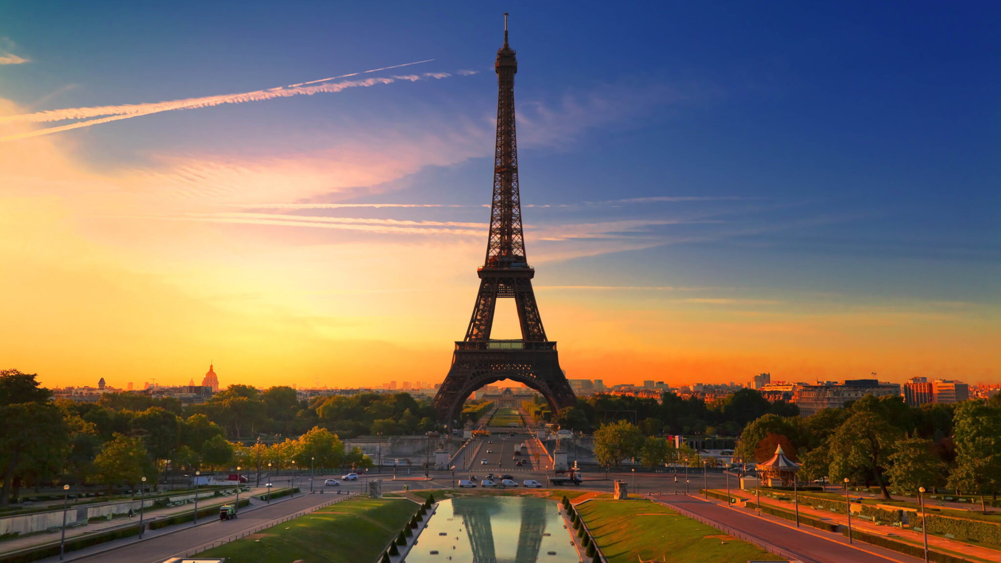 straight view of eiffel tower paris during sunrise with blue sky background 4k 5k hd travel 2048x1152 1