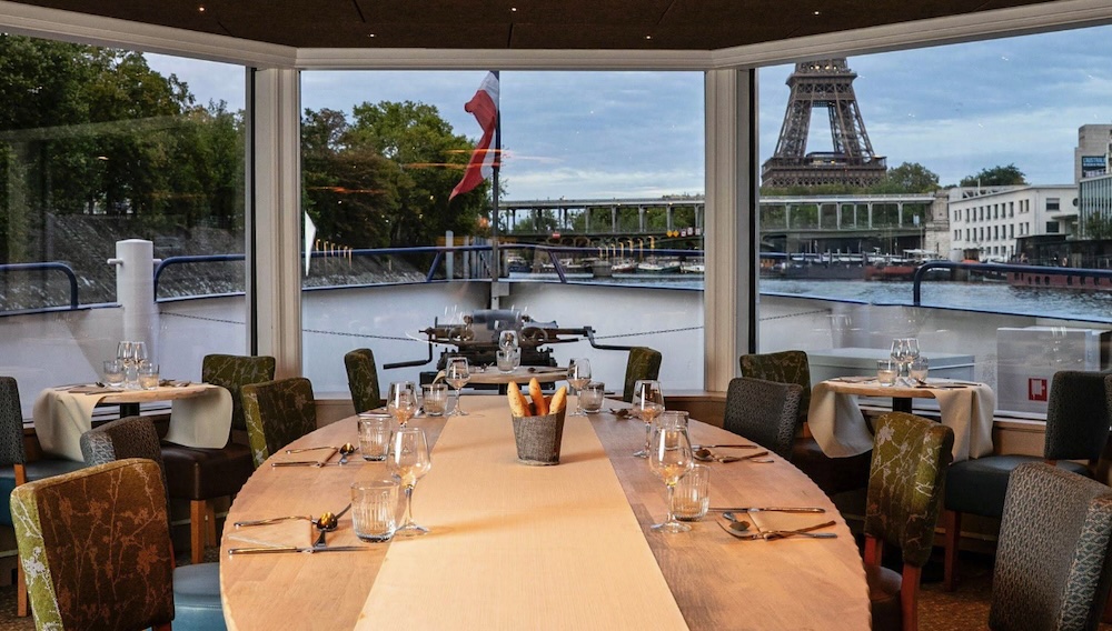 Best Seine Dinner Cruises in Paris (2026) 4 Le Capitaine Fracasse dinner cruise boat departing from Swan Island near the Eiffel Tower
